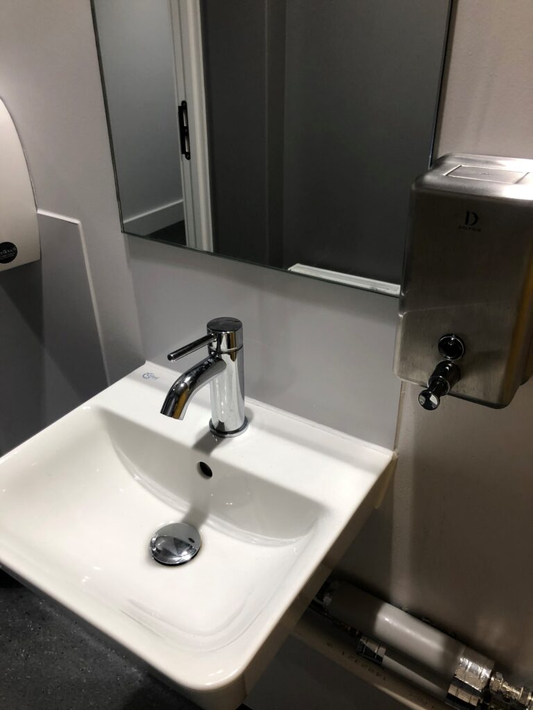 Soap dispenser and sink close up